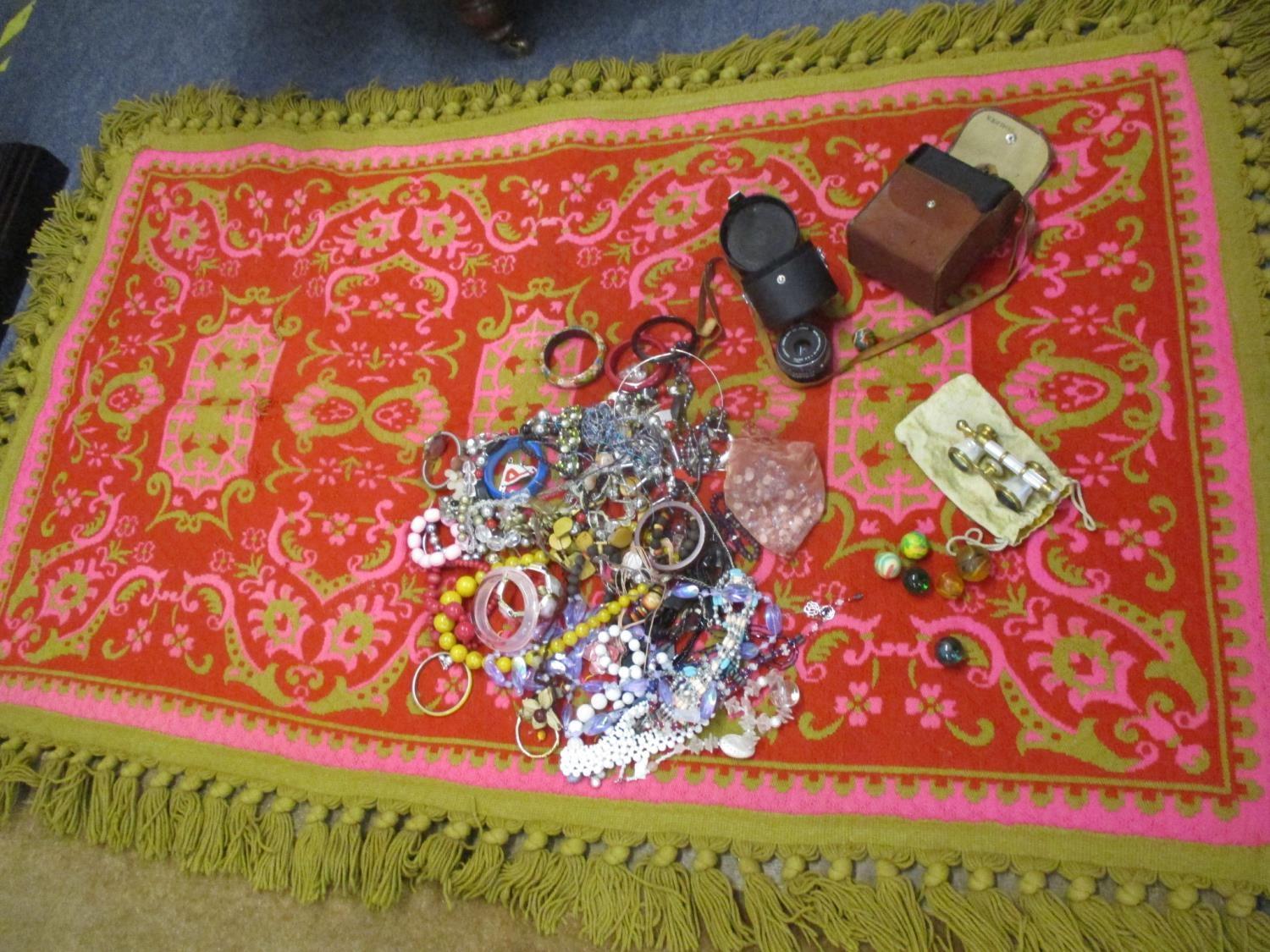 A Retro Casa Pupa style pink ground rug together with costume jewellery, an Oris watch, mother of