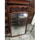 An early 20th century mahogany framed mirror with fretwork ornament 122cm h x 67cm w