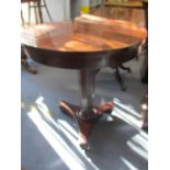 An early Victorian mahogany circular occasional table on a tri-form base