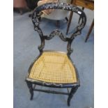 A Victorian black lacquered and mother of pearl inlaid side chair