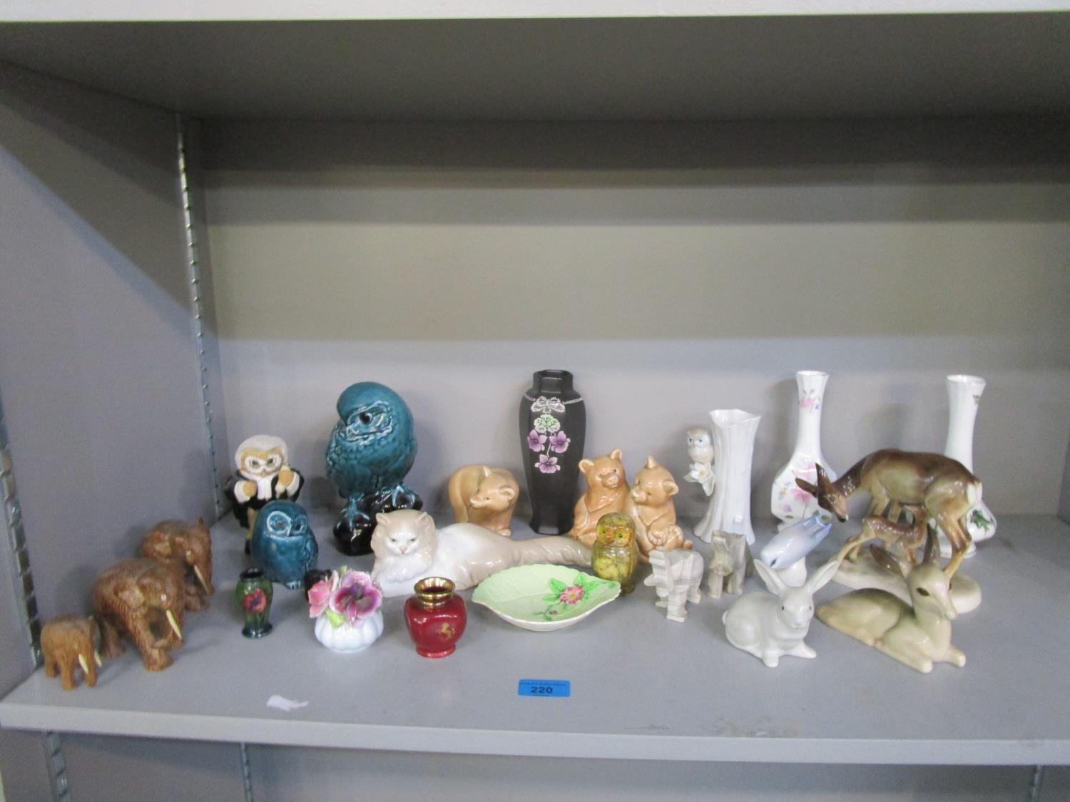 A mixed lot of mainly animal ornaments to include a miniature Moorcroft baluster vase, Hertwig