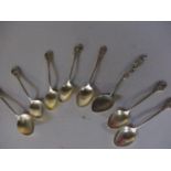 Seven similar Chinese silver teaspoons and a Japanese Nagasaki silver teaspoon with a dragon