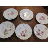 Four Meissen shallow bowls together with two smaller and deeper bowls (Condition: one shallow bowl