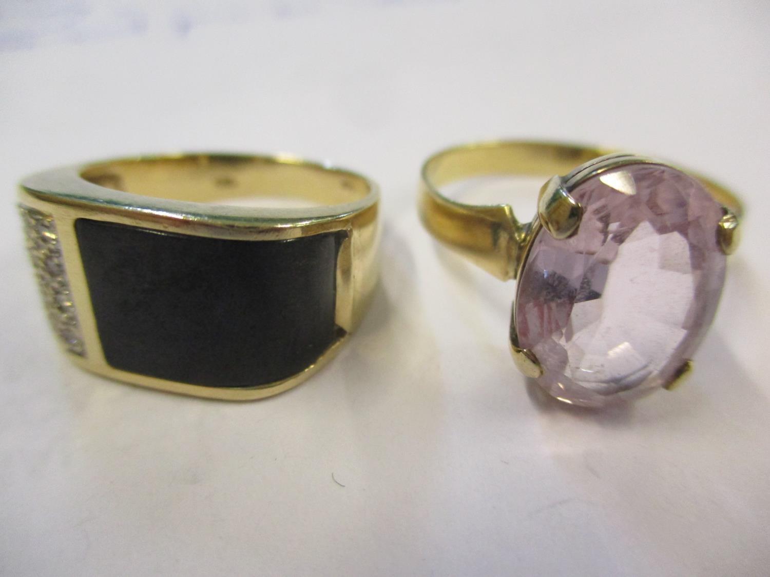 A gents 14ct, black stone and diamond chip ring, 5.1g together with a yellow metal and pink sapphire