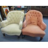 Two 19th century button back low salon armchairs having mahogany legs and on casters