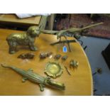 A group of brass ornaments to include an alligator nut cracker, Timson Bros ashtray, eagle with