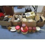 A quantity of vintage kitchenalia to include cast iron cookware pans, tin storage jars, jelly moulds