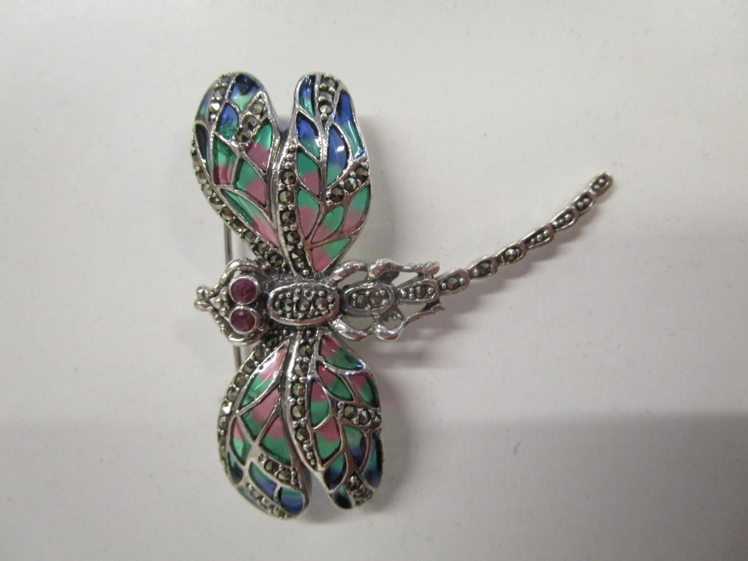 Silver dragonfly brooch/pendant set with ruby eyes and marcasites, and inlaid with coloured enamel