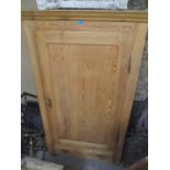 A reproduction pitch pine single door armoire with single drawer below, 175cm h x 102cm w