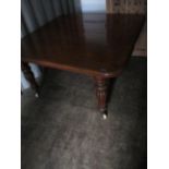 A Victorian mahogany dining table with two leaves A/F