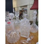 Six 20th century glass decanters with stoppers and two additional stoppers, together with a five