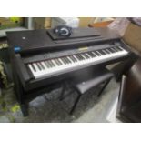 A Yamaha Clavinova CVP-92 digital piano with stool