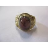 A 9ct gold and garnet cabochon gents ring, total weight 5.2g