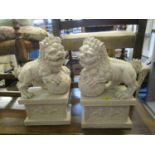 A pair of stone effect plastic lion dogs of foo on relief decorated rectangular plinths 48.1cm h