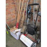 A quantity of garden tools to include post hole digger, electrical strimmer, Eckman push mower