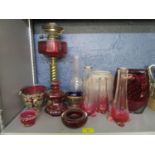 A selection of Victorian and later glassware to include a brass and cranberry glass oil lamp and