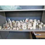 A good collection of crested Goss and other factories to include a Goss Parian figure group modelled