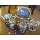 A desk top globe inset with semi-precious stones, two Franklin Mint tankards and two Sadler teapots