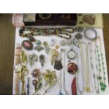 Good quality 20th century costume brooches, a ladies silver fob watch and other items of costume