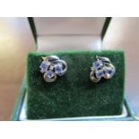 Ornate tanzanite and diamond stud earrings, boxed