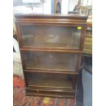 An early 20th century Globe Wernicke three tier oak bookcase 137cm h x 87cm w