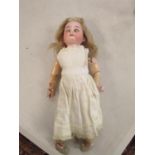 An Armand Marseille bisque headed doll with sleeping brown eyes, open mouth showing three teeth,