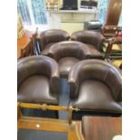 A set of five brown leather tub chairs on square tapering front legs