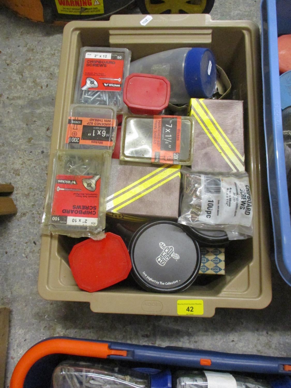 A large quantity of fixings and fasteners to include screws, felt nails etc (four crates)