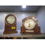 An Edwardian inlaid mahogany mantle clock on plinth base, housing a French movement, and a Newport