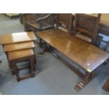 A reproduction oak rectangular coffee table on an H shaped stretcher 45.5h x 122cm w and a nest of