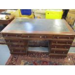 A Victorian mahogany twin pedestal desk, the top with inset leather scriber, one long flanked by two