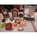 A mixed lot of cameras, mantle clocks, a wall hanging barometer and a cased AEG Olympia traveller de