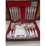 A modern Oneida eight setting stainless steel cutlery set purchased in 1996, unused, housed in a