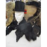 A G.A. Dunn silk felt top hat 19cm front to back, 15.25cm side to side, together with two fox stoles