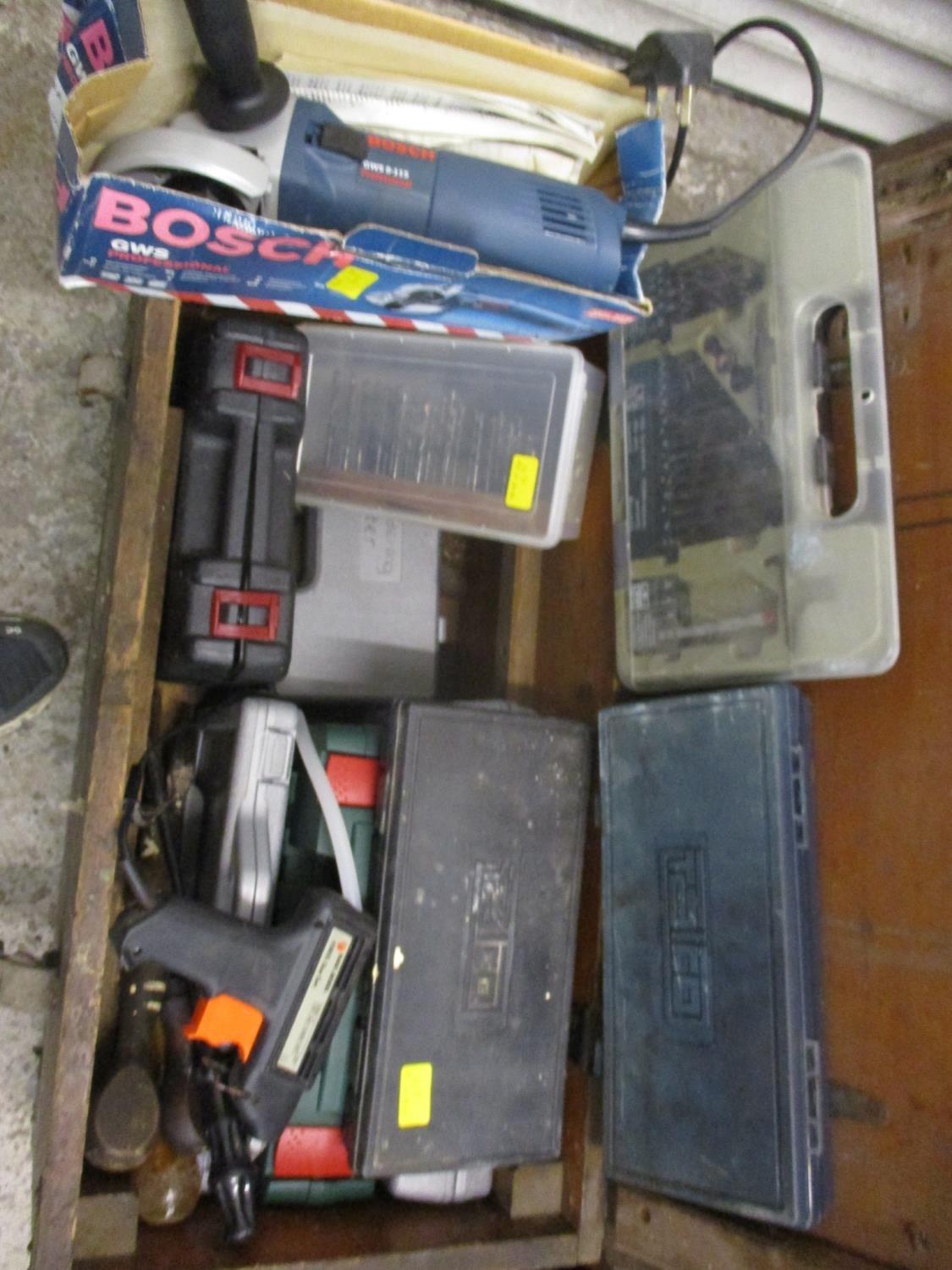 A tool chest housing socket sets, Bosch grinder, test kit, glue gun, drills and drill bits