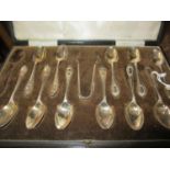 A cased set of Walker and Hall A1 silver plated eight teaspoons and a matching sugar tongs