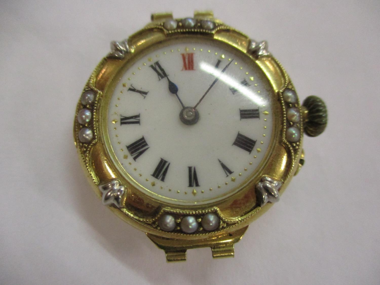 An early 20th century 18ct gold and seed pearl ladies watch, 17.3grams, deficient of strap