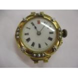 An early 20th century 18ct gold and seed pearl ladies watch, 17.3grams, deficient of strap