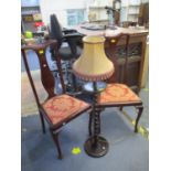 An early 20th century mahogany display cabinet, extended back with central flower head design,