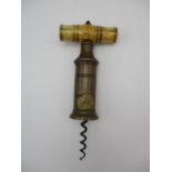A 19th Century brass barrel cork screw, with bone handle, inscribed "DOWLER", the barrel decorated