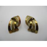 A pair of 14 ct gold clip on earrings, modelled as conjoined scrolls, in a Garrard velvet lined box,