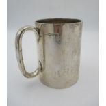 An Edwardian silver tankard by Stokes & Ireland Ltd, Chester 1910, of plain form with curved handle,