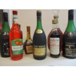 A selection of mixed bottled spirits to include Remy Martin cognac, 24 fl oz