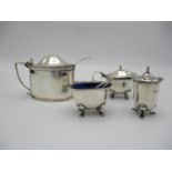 A George V silver three piece cruet set by Thomas William Lack, London 1933, comprising a lidded