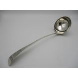 A George II silver serving ladle, London 1755, with engraved initial to the finial, weight 215 g, 34