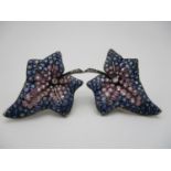 A pair of multi gem ivy leaf shaped earrings, set with a central diamond and diamond accents to