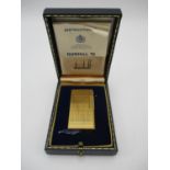 A Dunhill 70 gold plated lighter, in fitted presentation box, 6 cm high