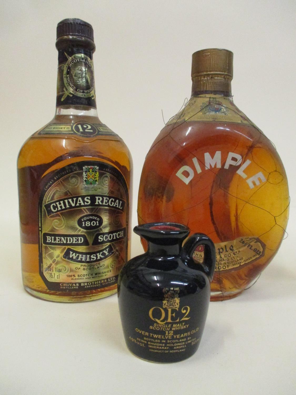 One bottle of Dimple Haig Whisky and one bottle of Chivas Regal blended Scotch Whisky along with a