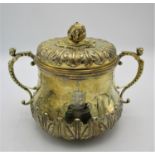 A large Edward VII silver gilt lidded bowl by Skinner & Co, London 1908, modelled with ornate