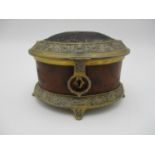A Victorian brass mounted wooden box, of oval form with filigree style brass rim to the lid and base